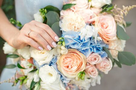 Bride showing off her beautiful boho flowers bouquet chic boho wedding magazines and websites, bohemian, fashion, florist and other related subjects.の写真素材