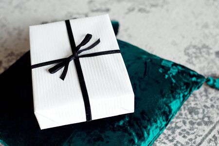 Beautiful Christmas gift boxes on floor near fir tree in room.の写真素材