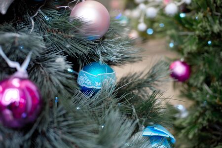 Christmas tree branches balls decoration New Year with bokeh lights on backgroundの写真素材