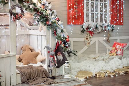 Beautiful holdiay decorated room with Christmas tree with presents under it - Image. Christmas home interior in red blue tones.の写真素材