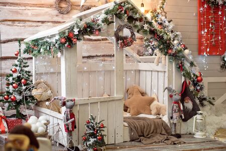 Beautiful holdiay decorated room with Christmas tree with presents under it - Image. Christmas home interior in red blue tones.の素材 [FY310136761479]