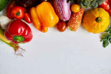 Top view assorted fresh organic vegetables on table in the kitchen in sunlight, grocery healthy shopping, vegan foodÐ± flat lay, copy space. Layout with free textの写真素材