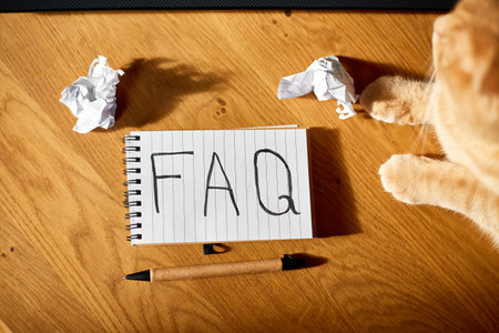 Faq, frequently asked questions text on notebook 
on wooden  background, Social Online Business communication,  concept.の写真素材