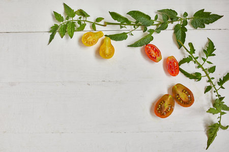 Flat lay Pattern composition with fresh ripe tomatoes on white background with copy space,  Tasty and healthy food, top view.の写真素材