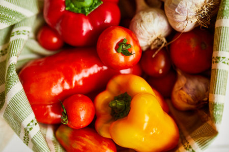 Top view assorted fresh vegetables in reusable cotton bags on table in the kitche in sunlight, groceries in textile Zero waste bags, Online grocery healthy shopping, vegan food.の写真素材