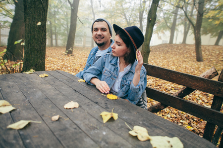 Real happiness. Joyful loving couple hugging and smiling. They are looking at each other. Couple in love. Autumn atmosphere. Style.の写真素材