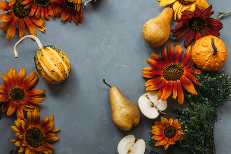 Autumn still life with seasonal fruits,vegetables and flowersの写真素材