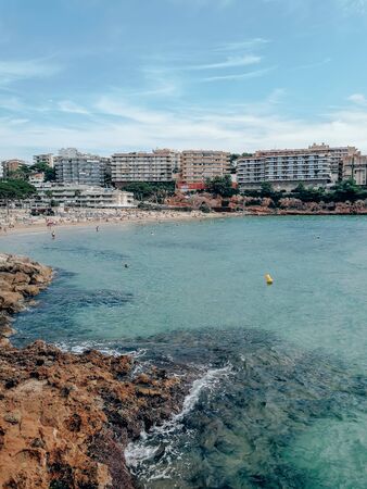 Coast of Spain, city of Salou, Costa Dorada. Seascape with bright blue sky, greenery and a beautiful...