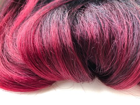 Close-up of overhead hair with reddish shades. Kanekalons and hair tresses, overhead locks. Application in the field of beauty salons, sale of hair accessories and others.の写真素材