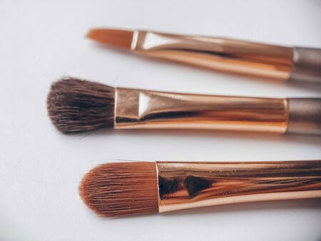 Make-up brushes on a white background. Front view. Beauty concept. Makeup template. Application in the fashion and beauty industry.の写真素材