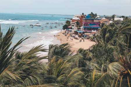 View from the balcony of the Indian Ocean coast in the city of Hikkaduwa in Sri Lanka. The concept of tourism and leisure.のeditorial素材
