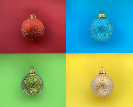 A collage of four photography, each with a Christmas ball against a background of the same color as the ball, green, red, blue and yellow. Festive concept.の写真素材