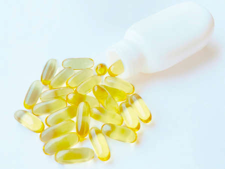 Close-up texture of many omega 3 capsules. Polyunsaturated fatty acids. The concept of a healthy...