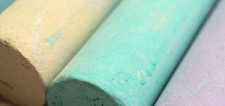 Close-up texture of chalk for drawing multicolored green, blue, yellow, purple..