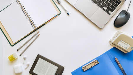 Layout on the topic of working process or education on a white background with notepad, pen, laptop,...
