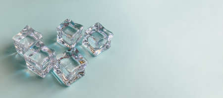 Ice cubes on a bright blue background. Summer conceptの写真素材