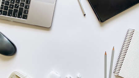Layout on the topic of working process or education on a white background with notepad, pen, laptop,...