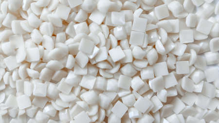 Close-up, white square diamonds for diamond embroidery. Hobbies and DIY, materials for creating...
