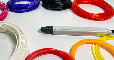 3D pen for drawing three-dimensional objects made of plastic and a lot of multi-colored plastic for...