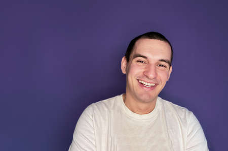 Portrait of a caucasian man smiling and happy isolated on color of the year 2022 very periの写真素材