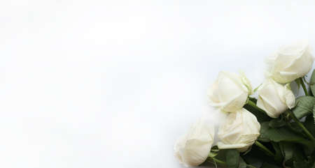 Flowers composition. Frame made of white flowers on white background. Valentines day, mothers day and womens day conceptの写真素材