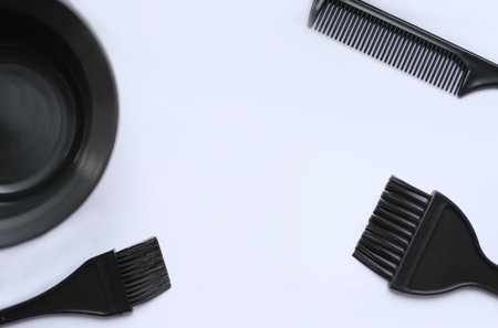 Top view, flat lay, hair coloring accessories, brushes and combs isolated on white backgroundの写真素材
