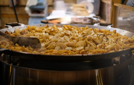 A pan of food is being cooked in a restaurant