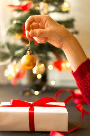Christmas ball in hand. Christmas tree decoration.の写真素材