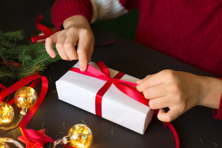 Boy preparing presents for Christmas.の写真素材