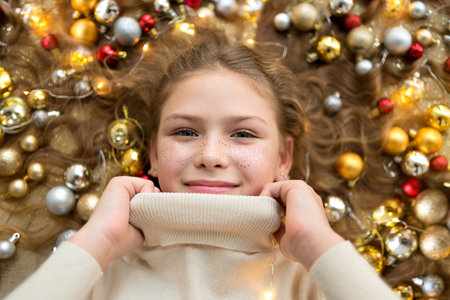 Teenager girl in cozy winter sweater.の写真素材