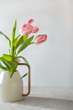 Elegant tulip flowers bouquet on a neutral background, aesthetic spring greeting card design, copy space. Mother's day, women's day, Valentine's day conceptの写真素材