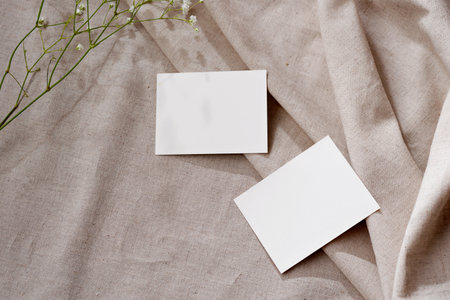 Two blank parer cards with mockup copy space on a neutral linen beige background, aesthetic spring summer business brand templateの写真素材