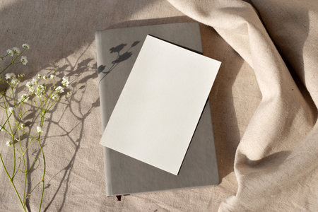 Blank paper card and notepad on a neutral beige background, aesthetic natural brand template with...
