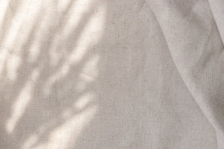 Aesthetic boho wedding textile background, draped neutral beige linen fabric texture with an...