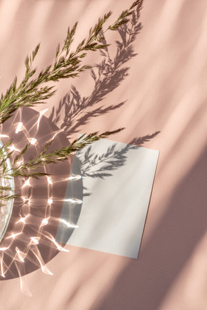 Blank paper card mock up with copy space on peach beige background with aesthetic sunlight shadow and crystal reflections, minimal neutral busines brand, wedding invitation templateの写真素材