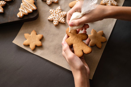 Christmas gingerbread cookie decoration with sugar icing. Soft selective focus, lifestyle.の写真素材