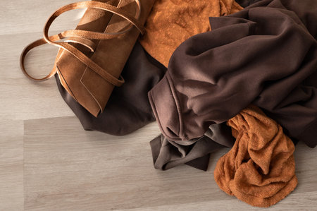 Various jersey clothes in natural autumn earthy colors, lifestyle concept
