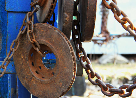 Rusty, rusty metal sports simulators. Inside, loads, chains, weights rust from old age. Equipment for outdoor fitness, history. Vintage look.の写真素材