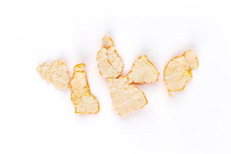 top shot on a white background there is a peel from a peeled tangerineの写真素材