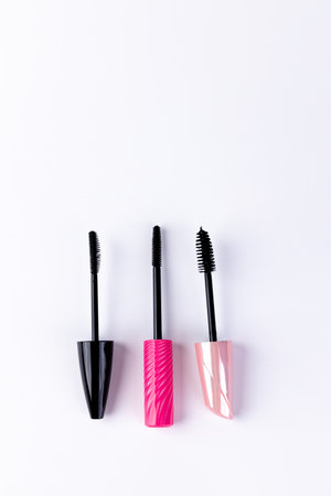 A Collection of Three Stylish Mascara Tubes â Black, Pink Twisted, and Soft Pink â Perfect for Enhancing Eye Makeup with Elegance and Charm in Your Beauty Routineの写真素材