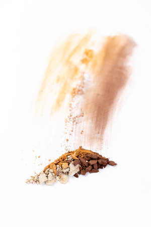 A Colorful Display of Various Spices and Powders Showcased on a Clean White Background Highlighting Natural Textures and Vibrant Hues for Culinary Inspiration and Creativityの写真素材