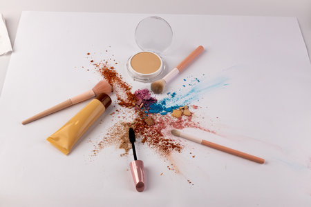 Vibrant Arrangement of Makeup Products Displayed on a White Background with Colorful Cosmetics and Tools for Beauty Applications and Enhancing Facial Featuresの写真素材