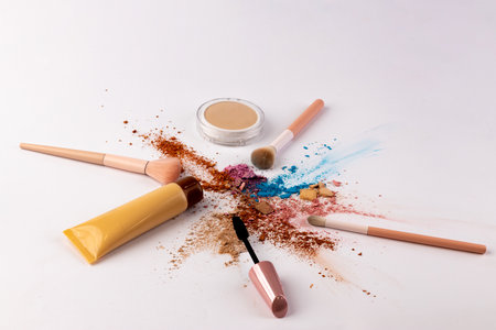 A Vibrant Display of Makeup Essentials Featuring Various Cosmetic Products Arranged Artistically on a White Background for an Eye-Catching Effectの写真素材