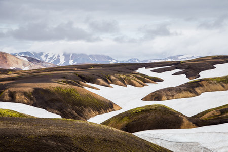 Breathtaking View of Icelandic Landscape Showcasing Colorful Mountains, Glacial Fields, and Majestic Wilderness in a Mystical Setting Filled with Natural Wonder and Splendorの写真素材