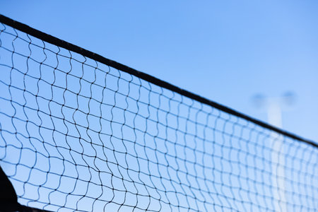 A Close-Up View of a Sport Net Against a Clear Blue Sky