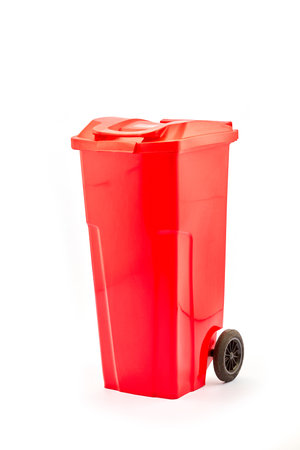 Bright Red Trash Bin with Wheeler for Easy Mobility and Waste Management in Modern Homes and Offices for Efficient Cleaning and Waste Disposal Solutionsの写真素材