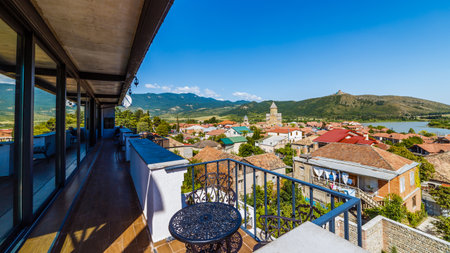 Stunning panoramic view from a balcony overlooking the charming town and picturesque landscape with...