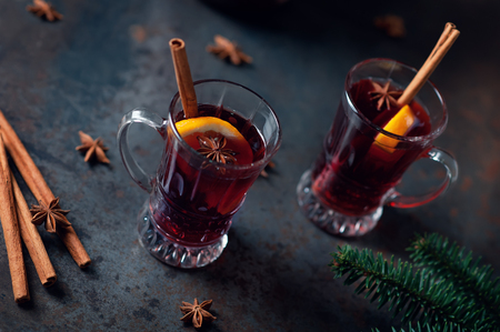 Top view of Traditional winter mulled wine in vintage glass on a metallic background, selective focus and toned image. Sangria on bar table. Celebration with spicy cocktail.の写真素材