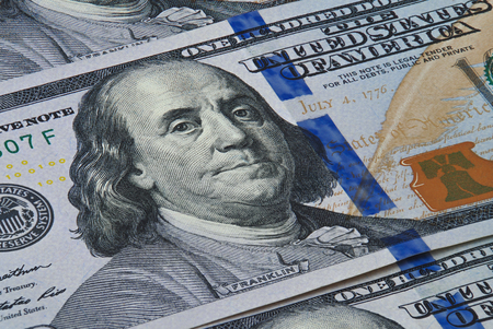 Banknotes in denominations of one hundred dollars photographed close upの写真素材
