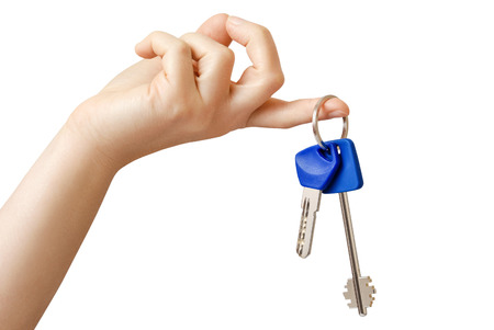 In hand are the keys from the door lockの写真素材